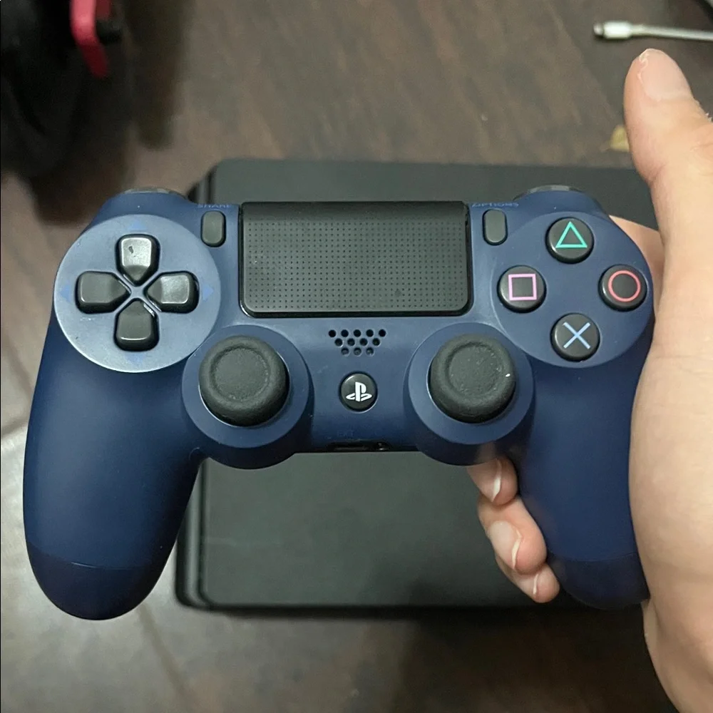 Sony PlayStation 4 Console with Black and Blue Controllers